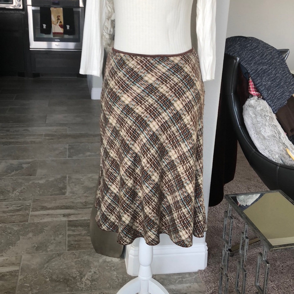 Soft brown and cream skirt with teal decoration.